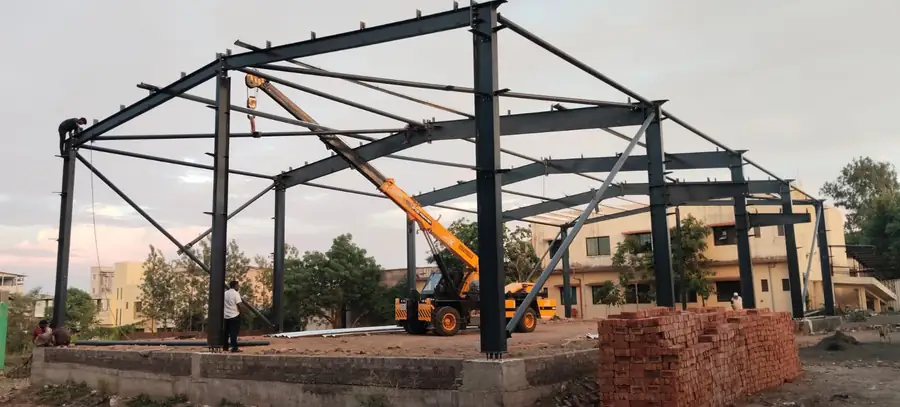 Structural frame being erected with a mobile crane on site