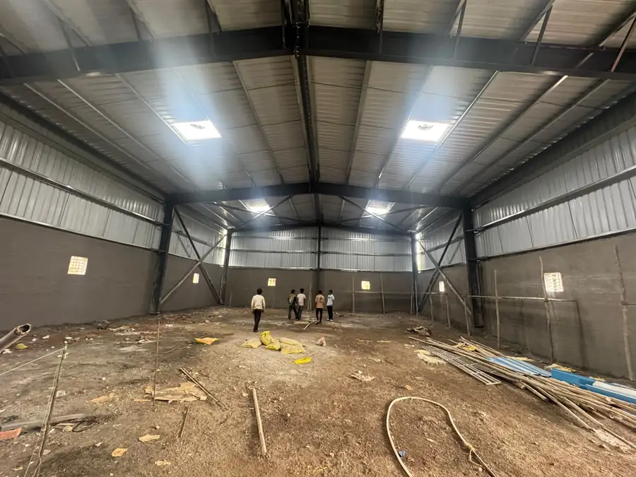 Finished factory shed interior with insulated roof sheeting