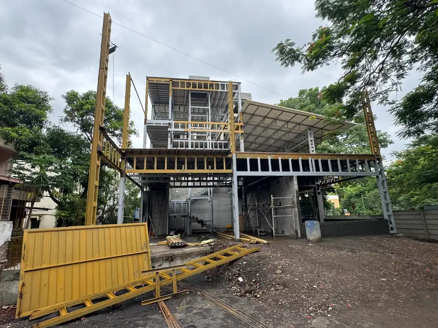 Steel mezzanine walkway and platform with safety-yellow edge protection