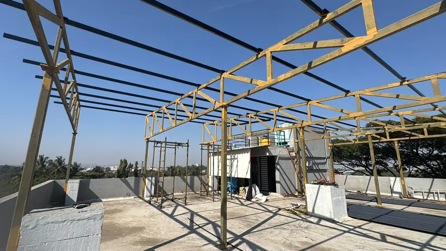 Industrial shed frame erection in progress with roof sheeting started