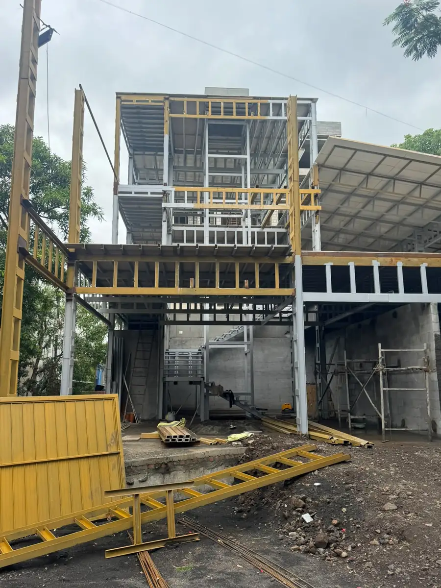 Two-level steel mezzanine structure inside an industrial building