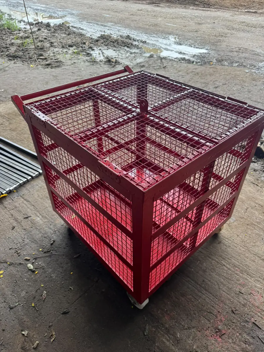 Red mesh stillage cage fabricated for component storage