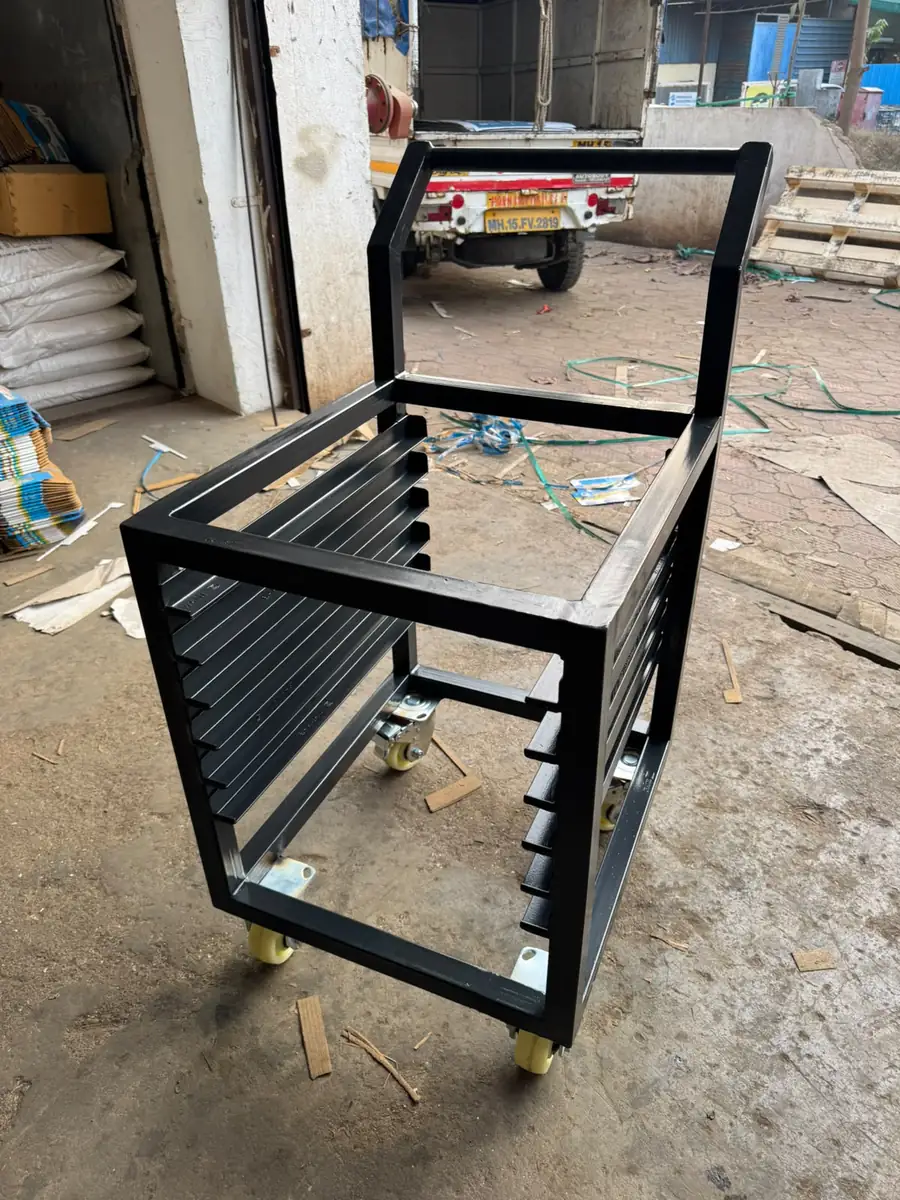 Slotted panel trolley frame fabricated in MS
